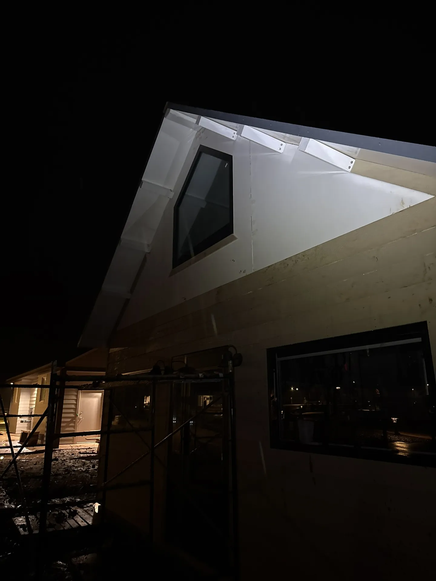 Boxabl unit lit up at night during Viking Solutions siding project — Liberty Village Hurricane Utah