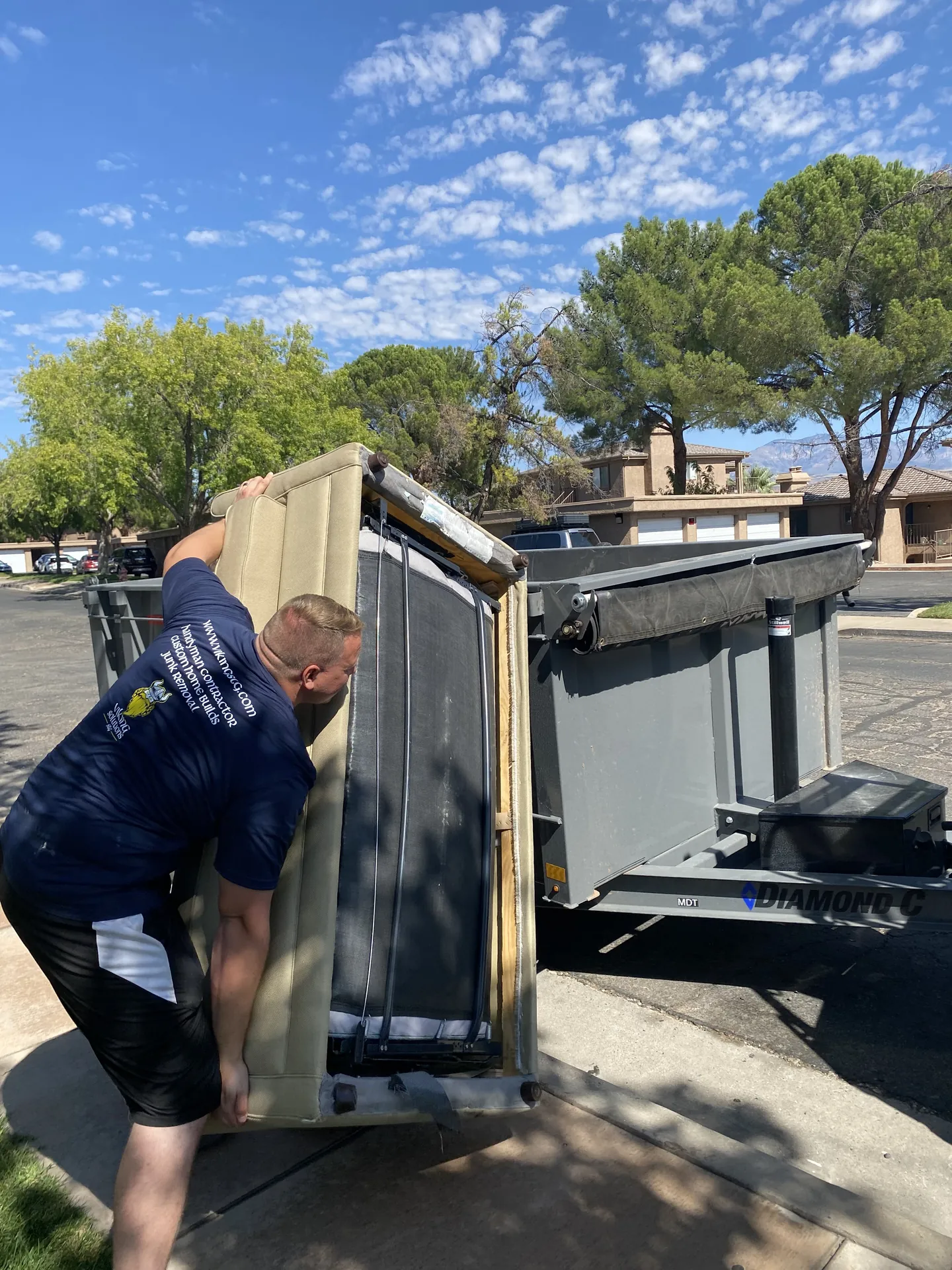 Viking crew hauling demo debris and old materials out of the apartment