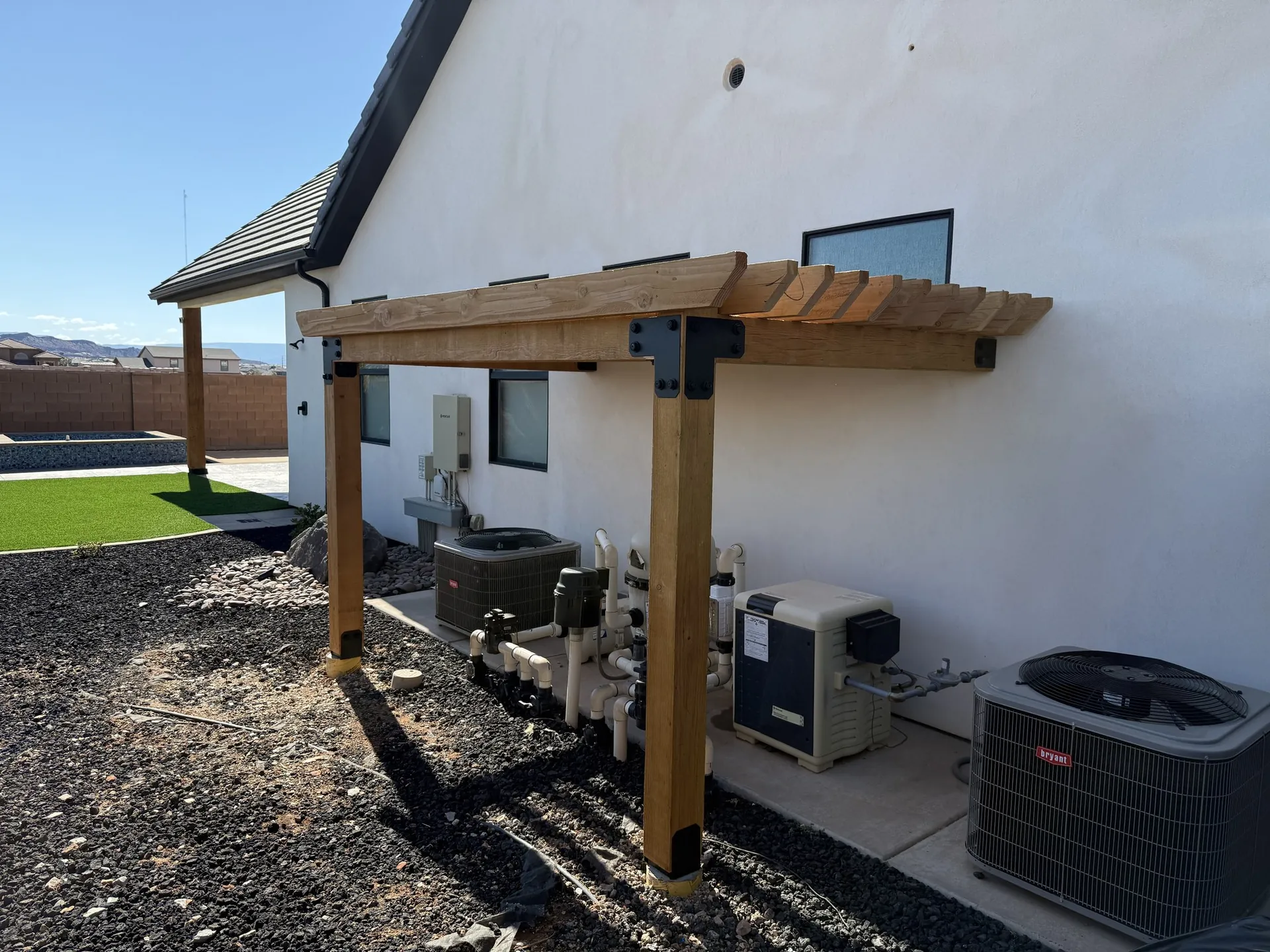 Custom cedar pergola built over a pool equipment pad in St. George, Utah